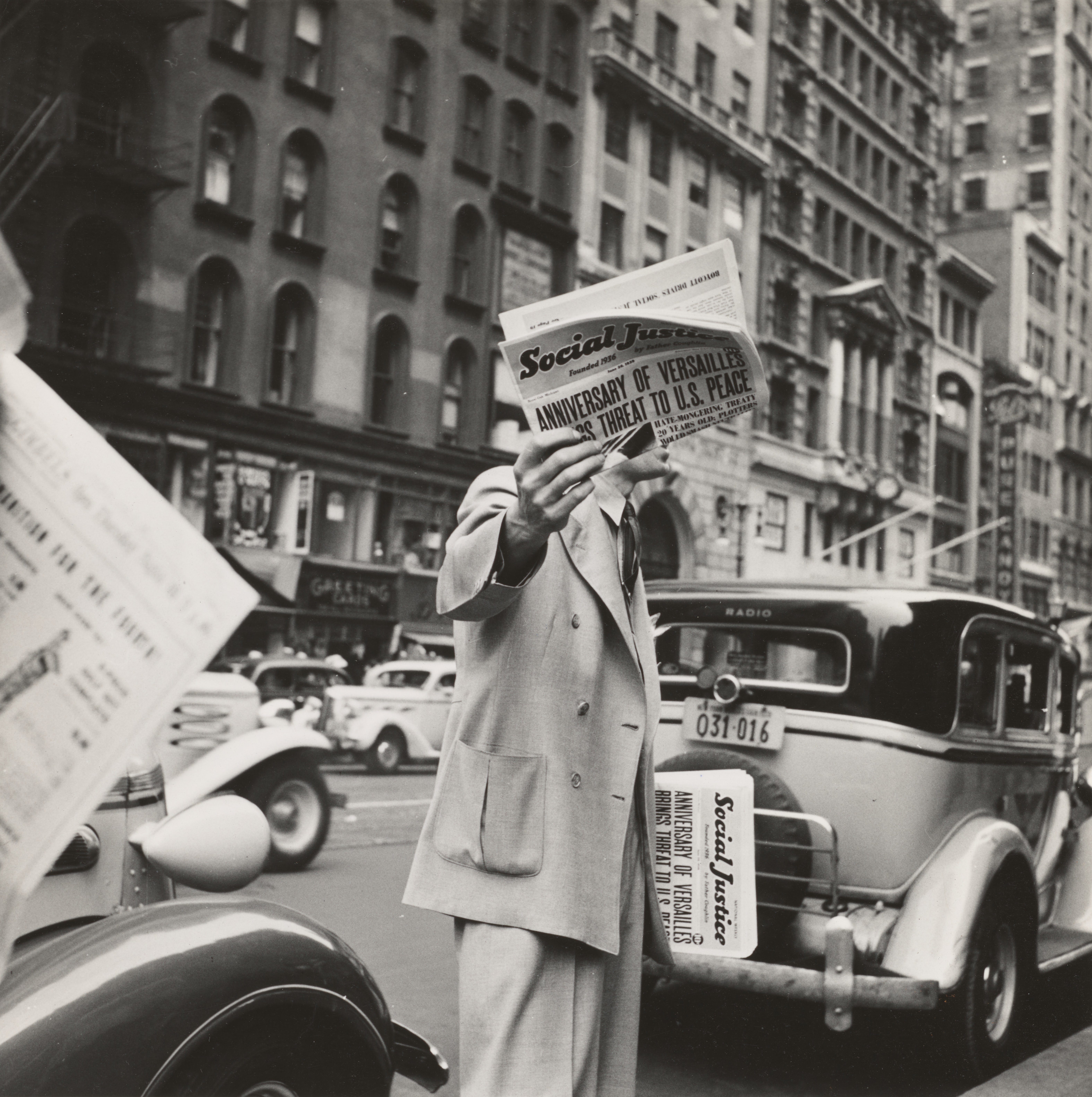 "Social Justice" newspaper sold on a street corner in New York City, in 1939