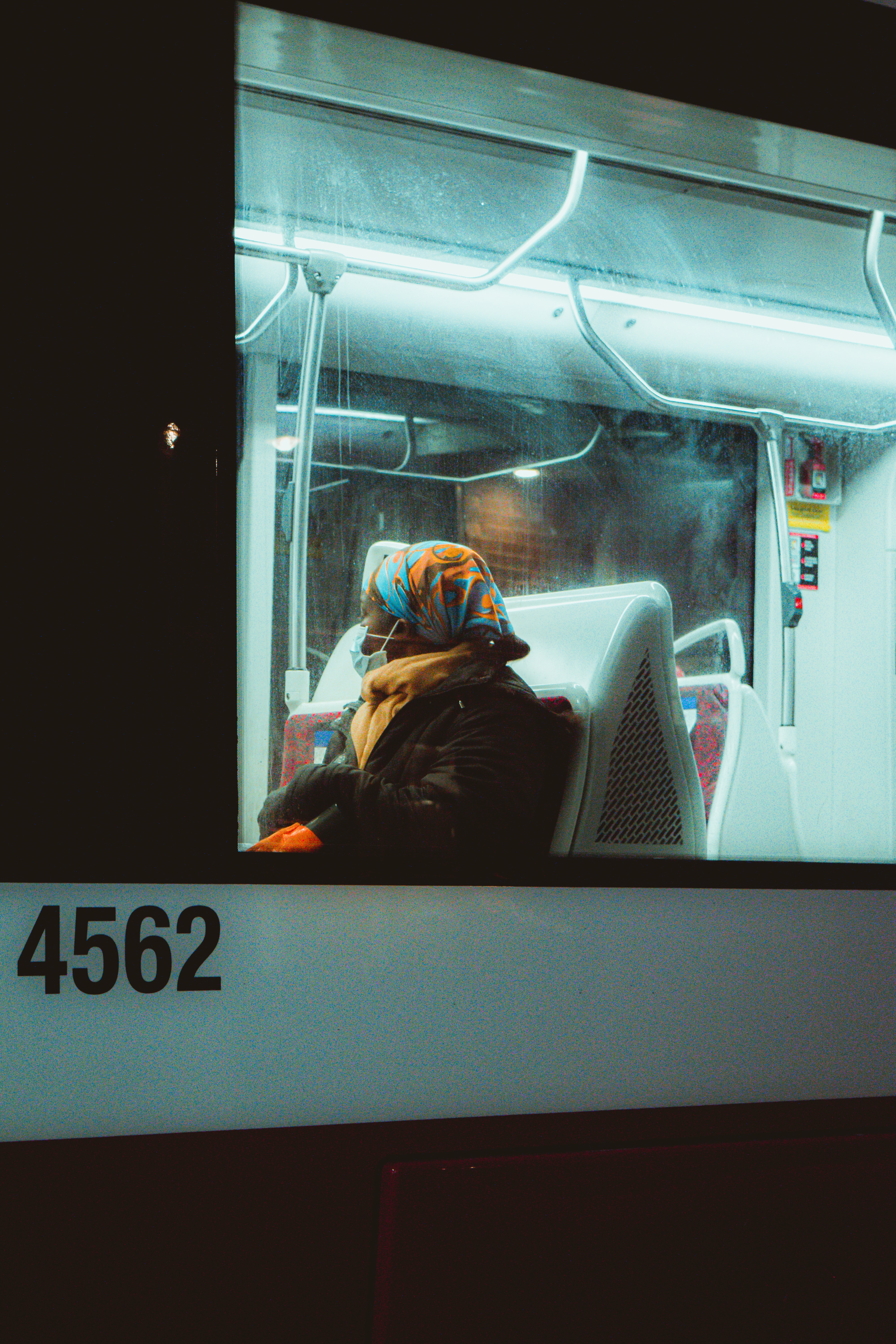 Woman wears a mask while aboard a TTC streetcar in Toronto, Canada